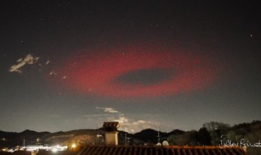 Over Italy, a sinister red ring appears to be an alien spacecraft.