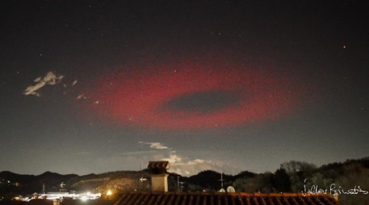 Over Italy, a sinister red ring appears to be an alien spacecraft.