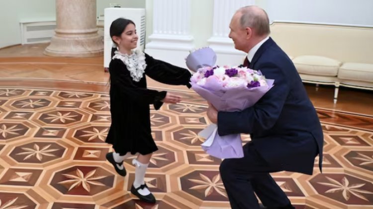 8-year-old girl smiles as she demands money from Putin for her native country